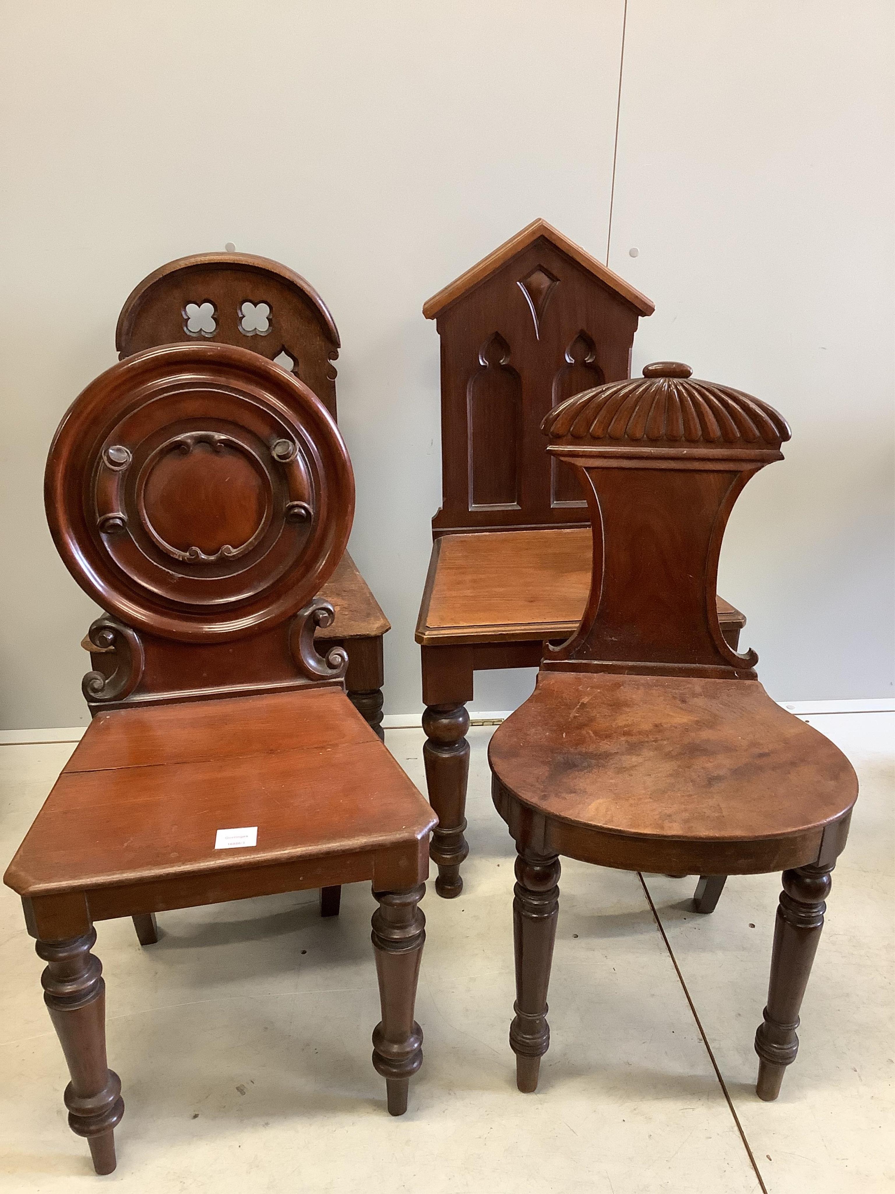 Seven George III and Victorian mahogany and oak hall chairs, largest height 95cm. Condition - fair to good